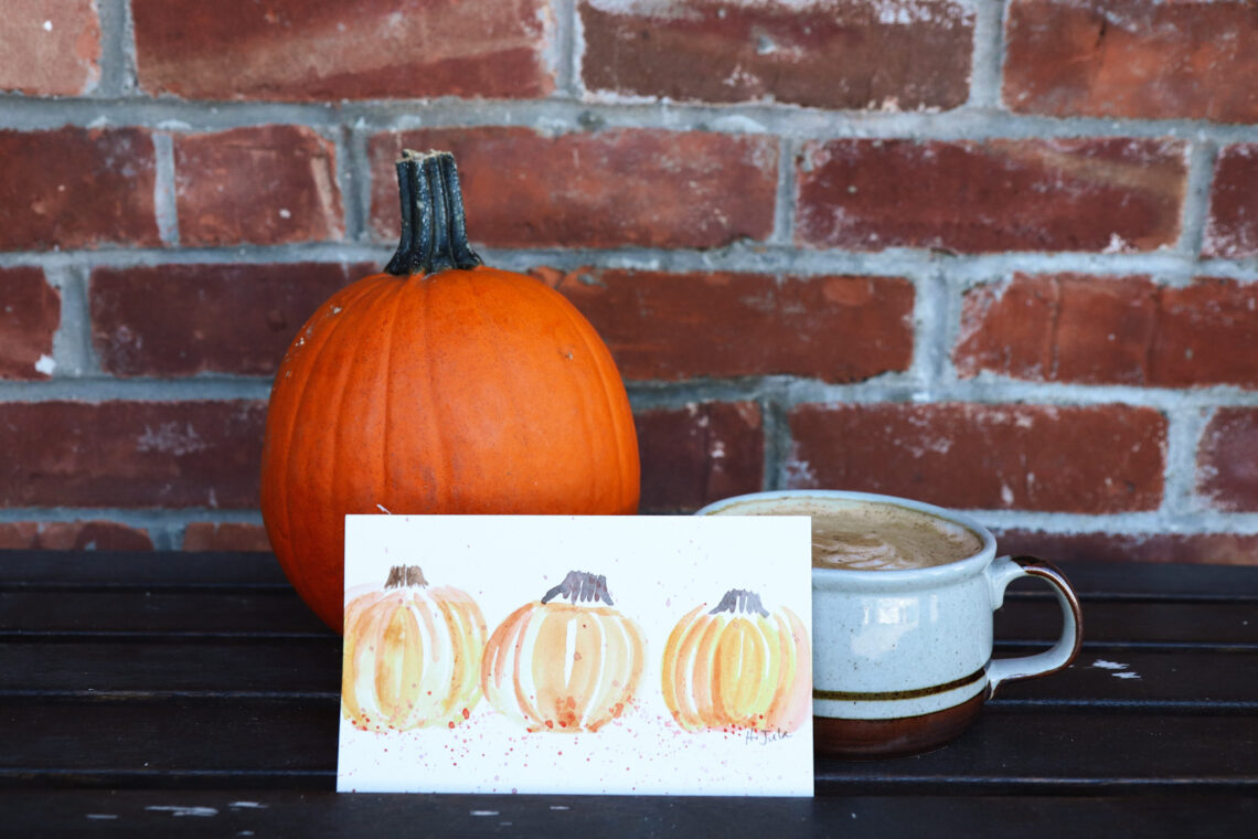 Autumn Watercolor art propped up on a shelf next to