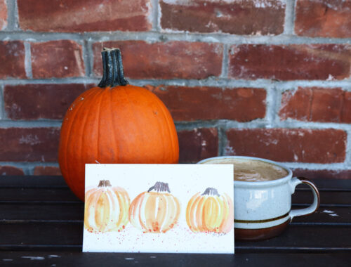 Autumn Watercolor art propped up on a shelf next to